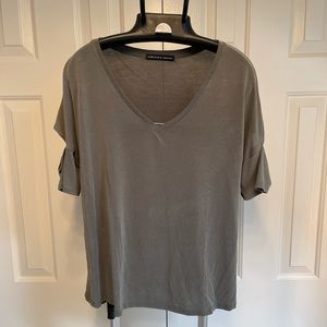 Small women’s blouse with peekaboo sleeve